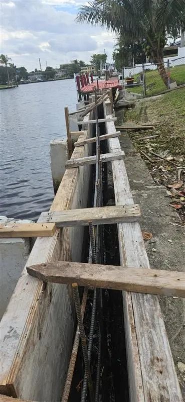 Newly constructed concrete seawall protecting a South Florida waterfront property